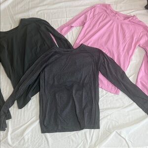 Set of three women’s Athleta momentum long sleeves